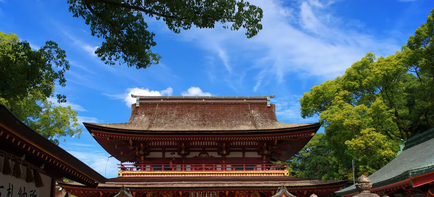 The vermilion two-story Romon gate at Dazaifu Tenmangu