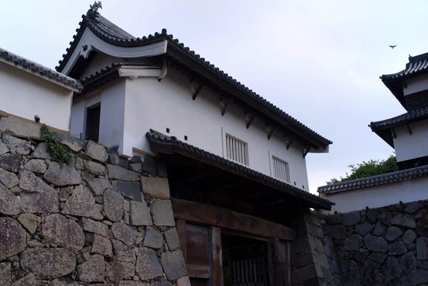 A restored gate and turret on the stone walls of Fukuoka Castle