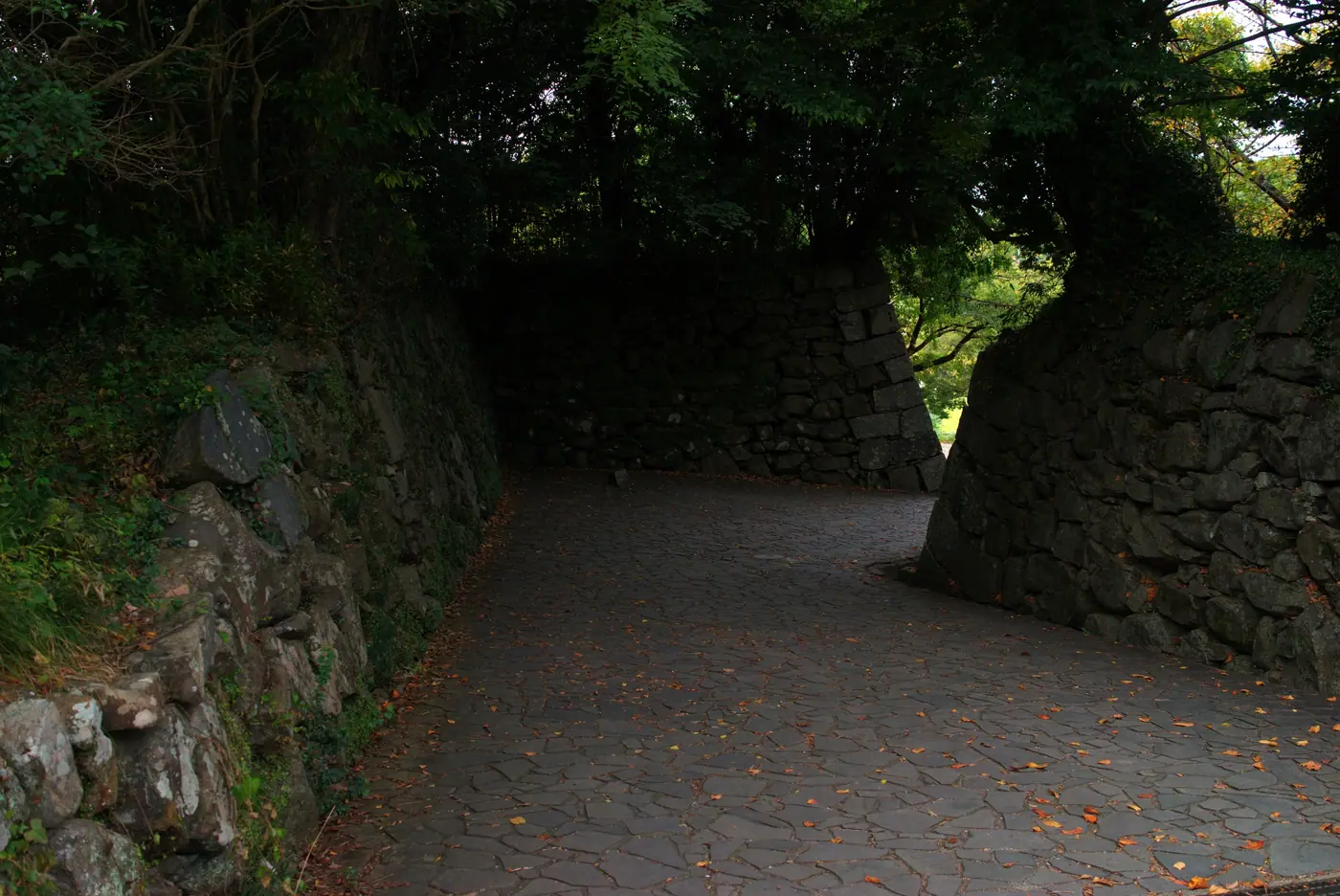 A sloping path between tall stone walls at Fukuoka Castle Ruins