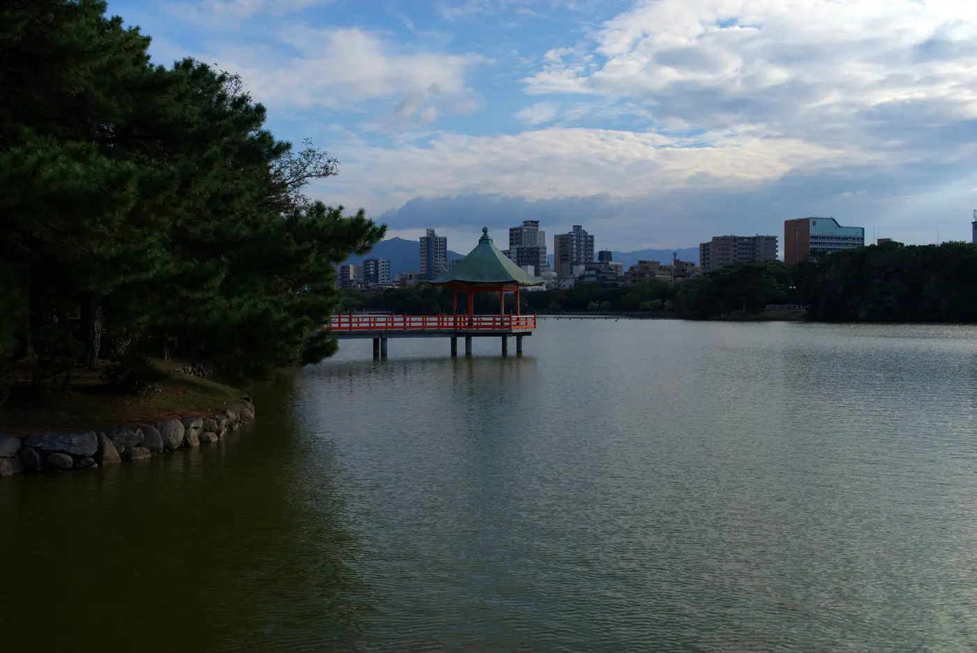 Ukimido pavilion on the water, seen past the pines at Ohori Park